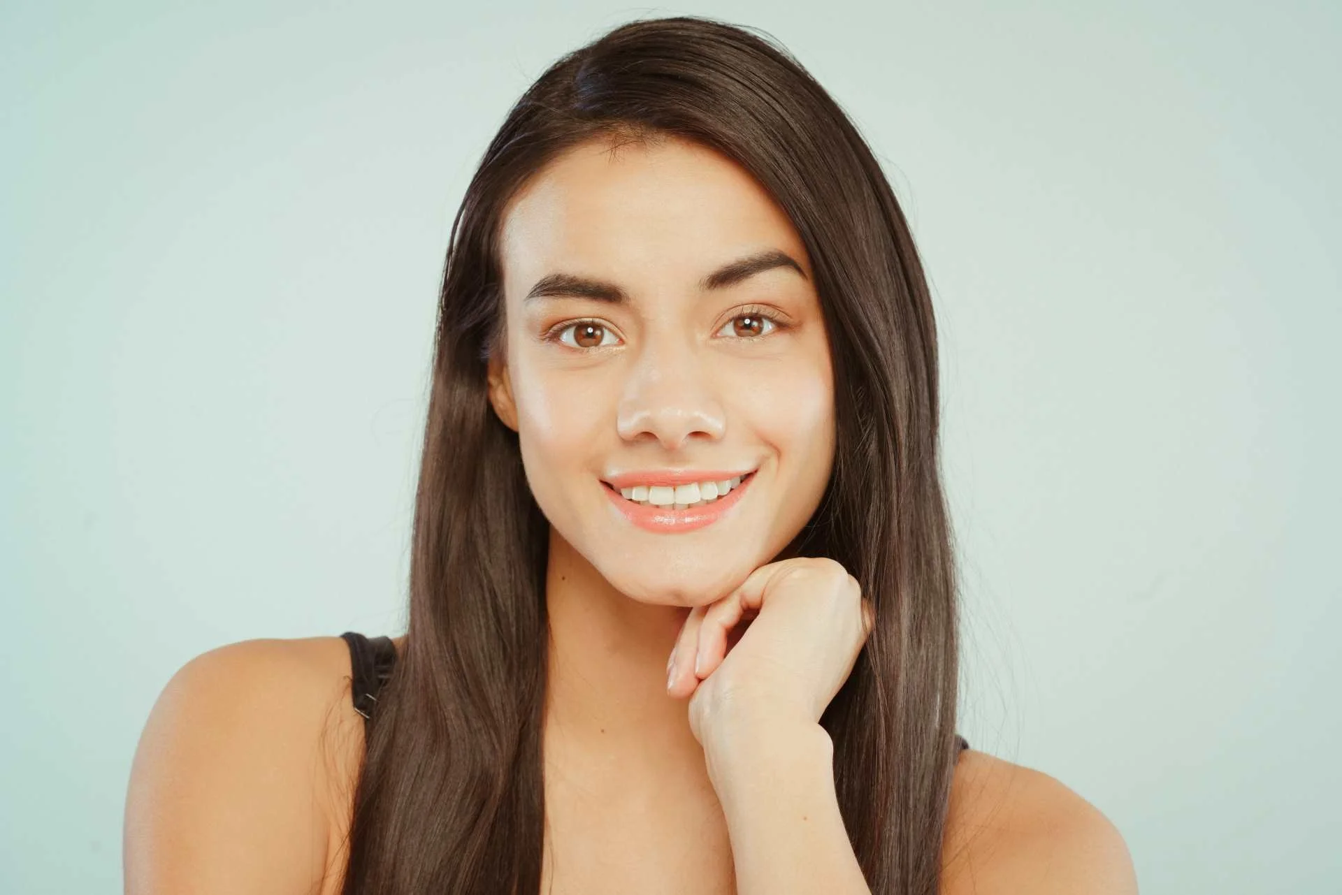 Smiling woman with long dark hair
